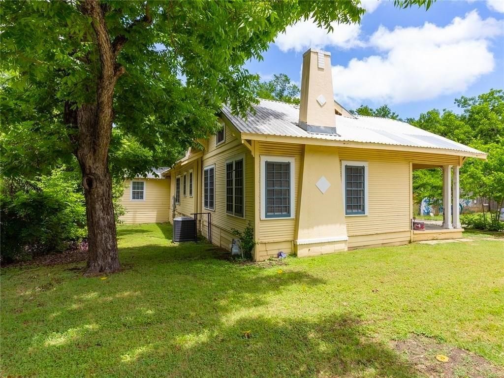 804 West 28th 1/2 Street Austin, TX 78705 - Photo 1 of 26 a view of a house with a yard and deck