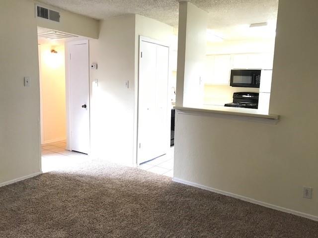 4748 Old Bent Tree Lane, Unit 803 Dallas, TX 75287 - Photo 6 of 20 a view of a room with a large window