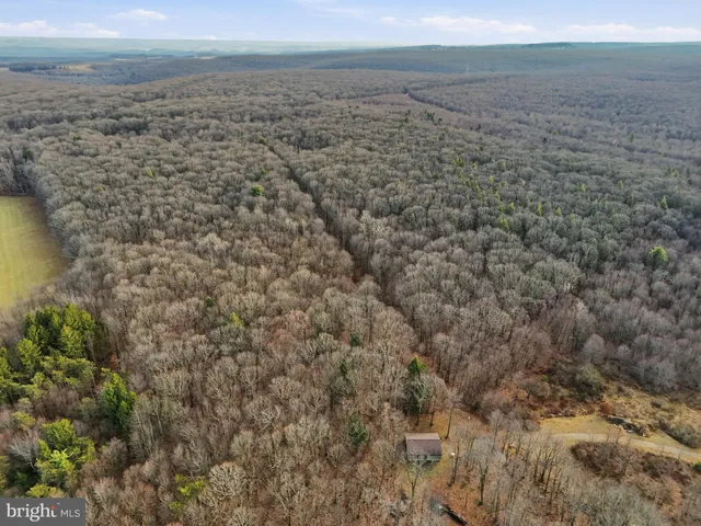 a view of a field with an outdoor space