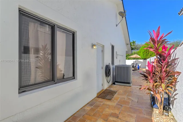 a view of a house with a potted plant