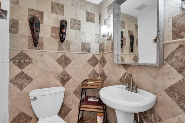 a view of a house with backyard sitting area and swimming pool