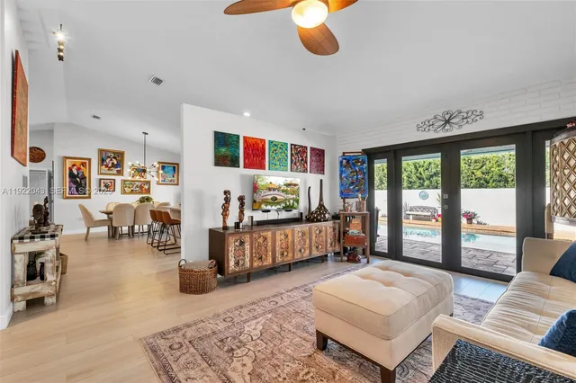 swimming pool view with a seating space