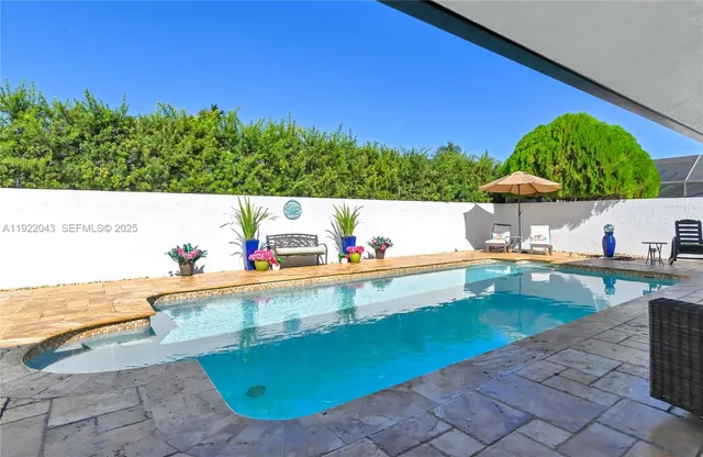a bedroom with bed and a chandelier