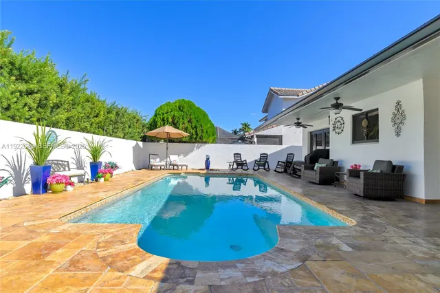 a view of a swimming pool with a patio