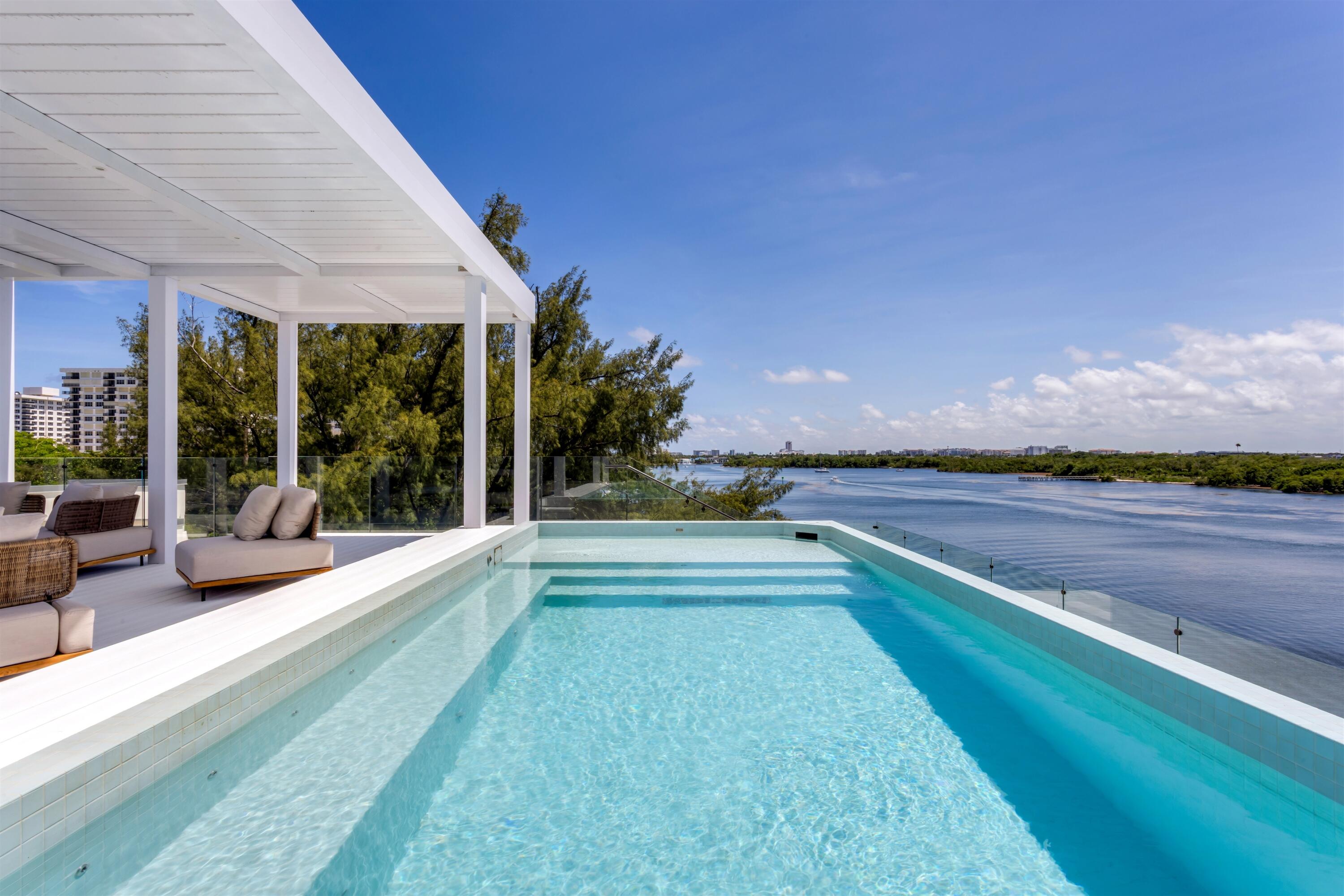 900 Lago Mar Lane, Unit PH Boca Raton, FL 33431 - Photo 37 of 58 a view of swimming pool with outdoor seating and yard