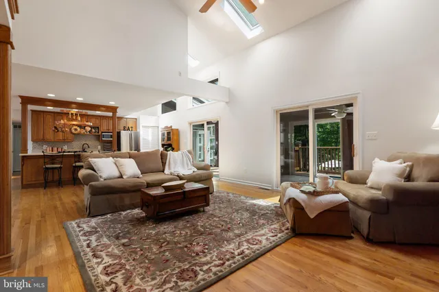 a kitchen with a table chairs sink and cabinets