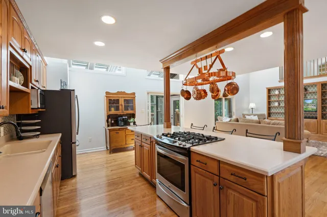 a view of a livingroom with furniture and a window