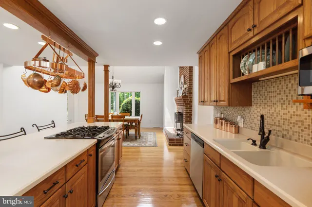 a spacious bedroom with a bed and a chandelier