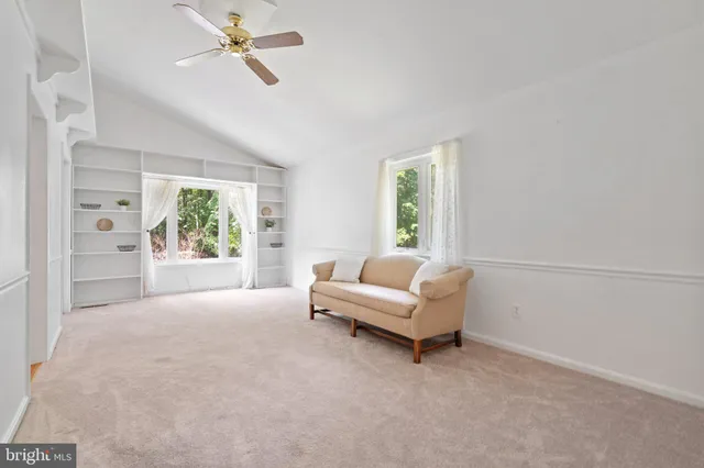 a bedroom with double bed and a window