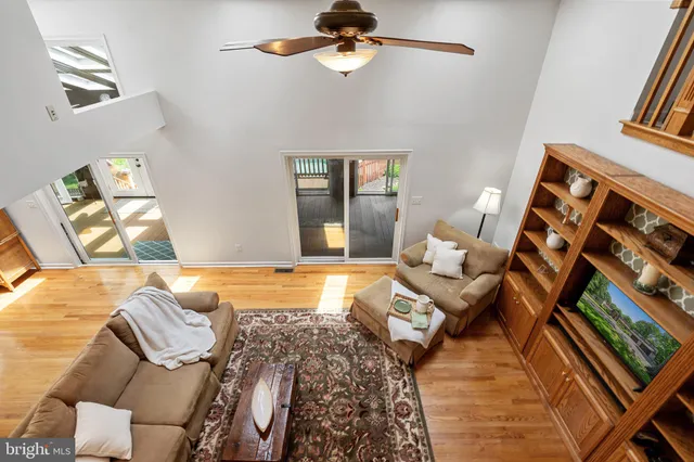 a swimming pool with outdoor seating and yard