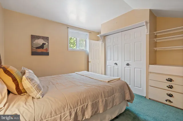 a view of a house with a yard and tree s