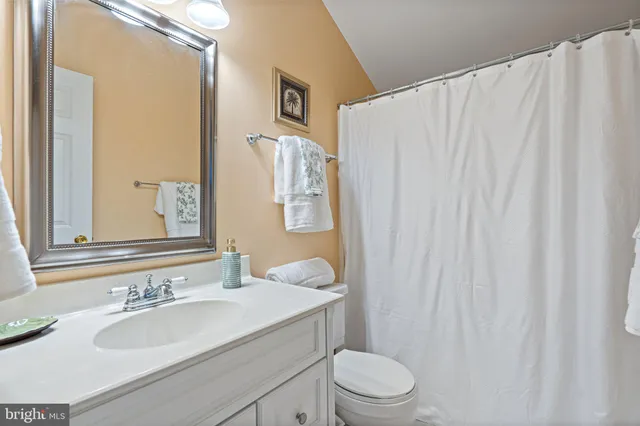 a front view of a house with a yard and a garage