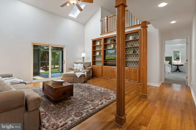 a living room with furniture fireplace and a floor to ceiling window