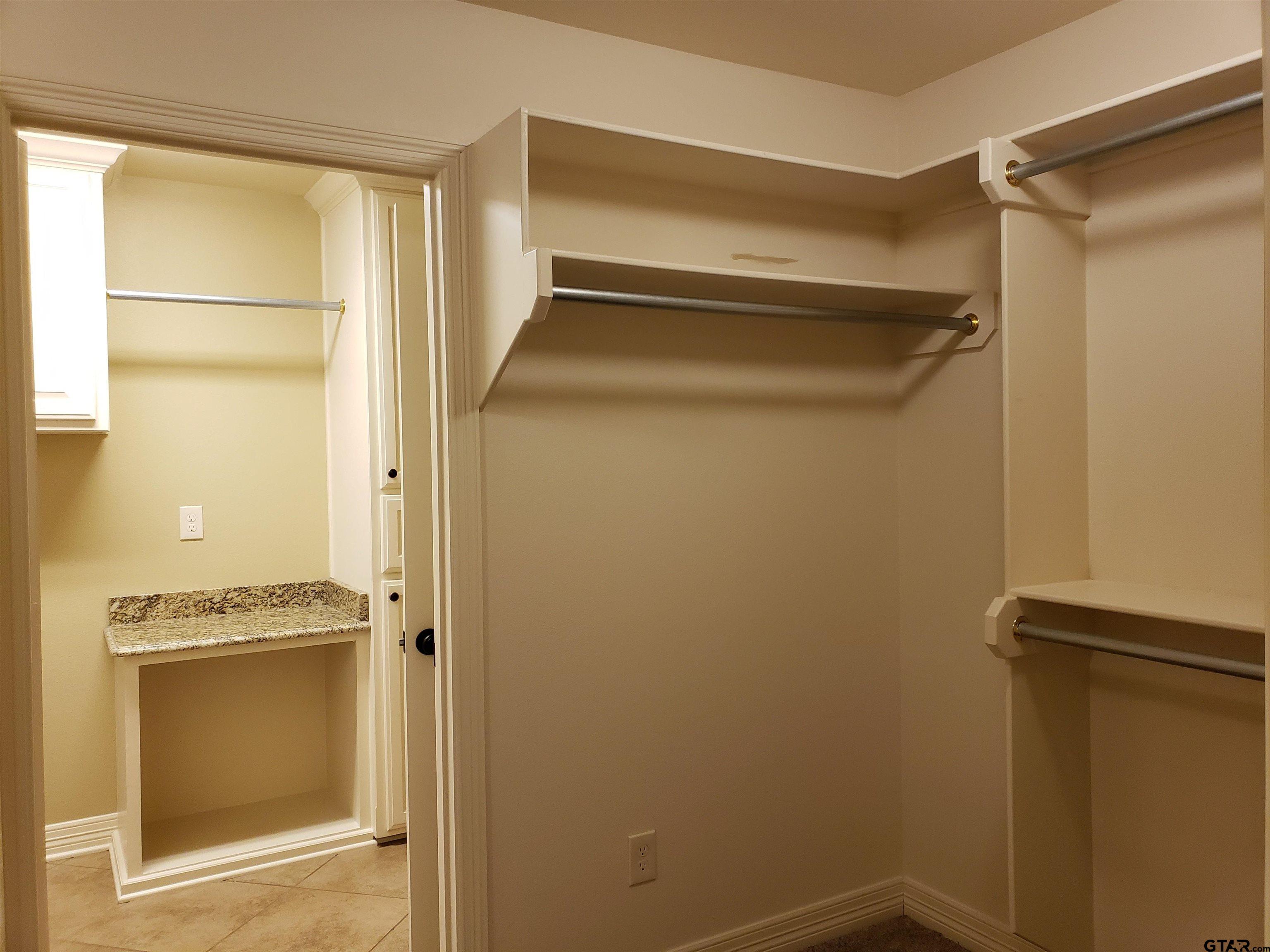 3700 Old Omen Road Tyler, TX 75707 - Photo 17 of 21 a view of walk in closet with empty racks