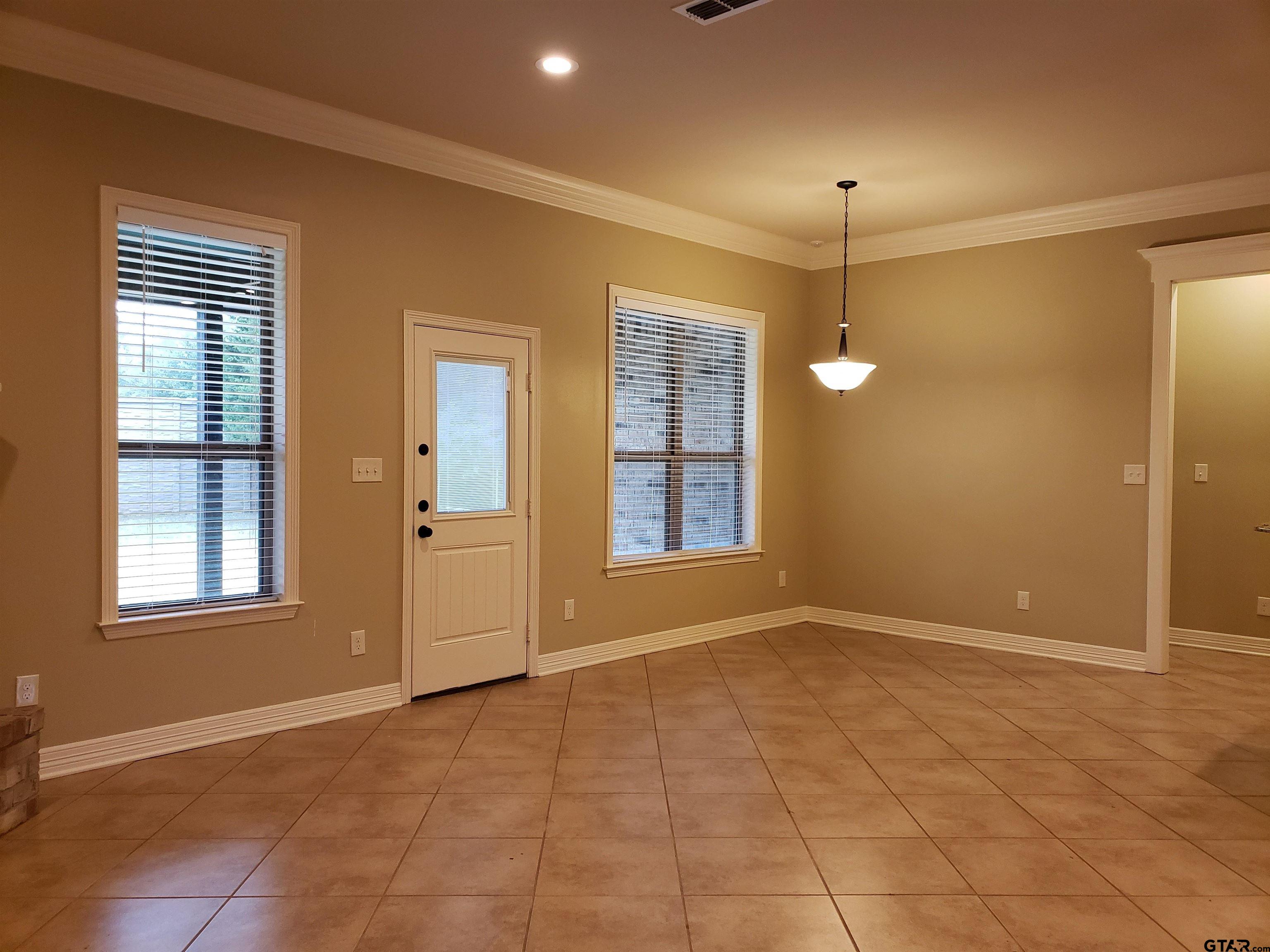 3700 Old Omen Road Tyler, TX 75707 - Photo 4 of 21 a view of an empty room with a window
