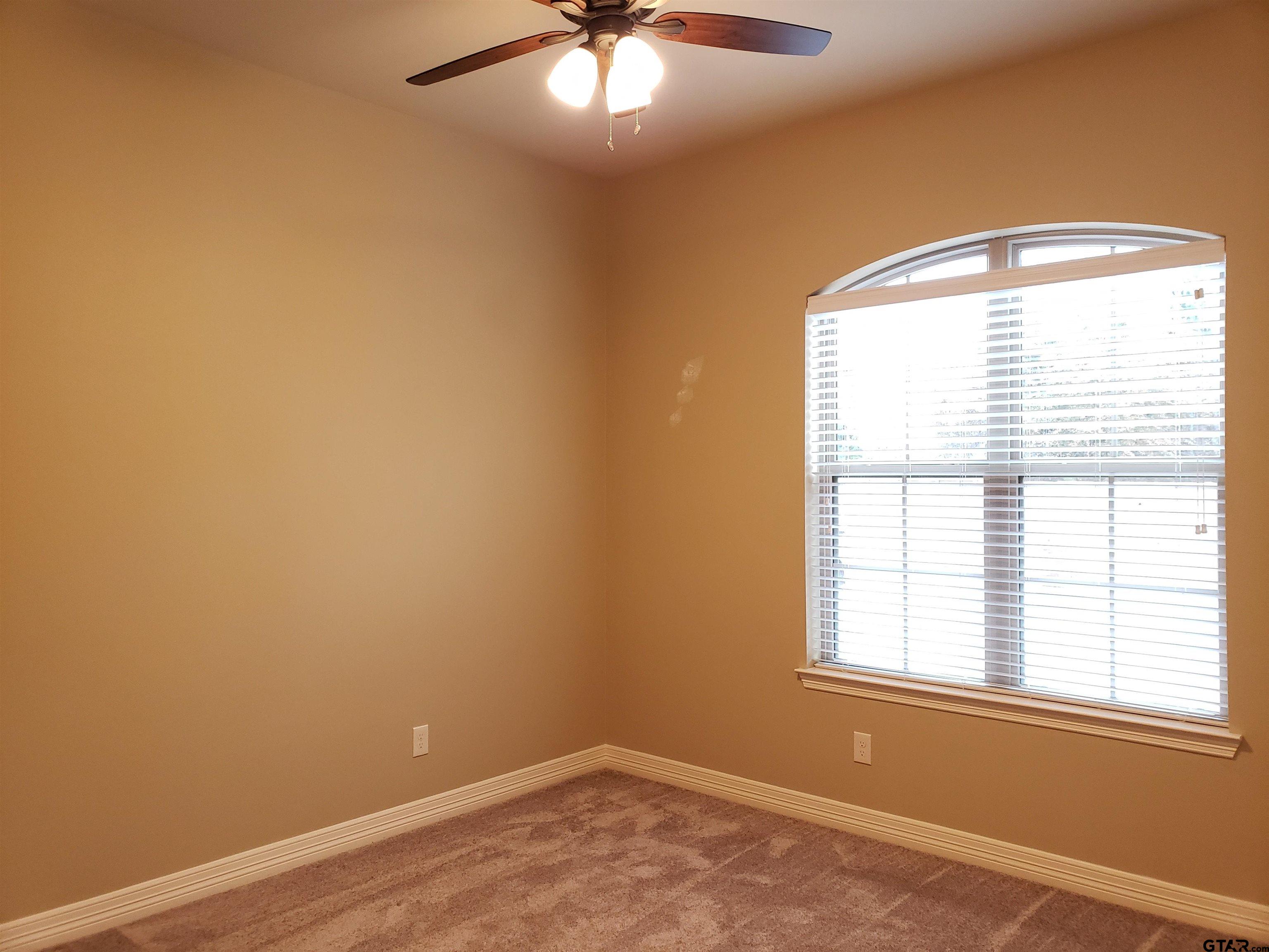 3700 Old Omen Road Tyler, TX 75707 - Photo 7 of 21 an empty room with a window