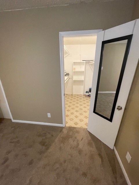 3535 NASA Road 1, Unit 49 Seabrook, TX 77586 - Photo 12 of 17 an empty room with mirror and door