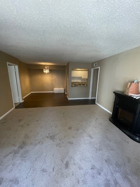 3535 NASA Road 1, Unit 49 Seabrook, TX 77586 - Photo 2 of 17 a view of empty room with wooden floor and fireplace