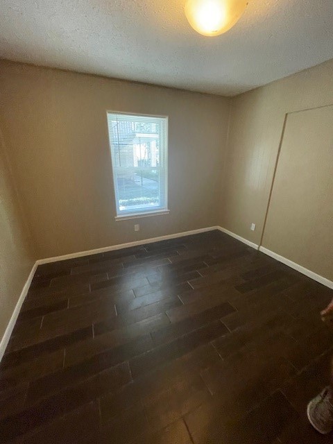 3535 NASA Road 1, Unit 49 Seabrook, TX 77586 - Photo 9 of 17 an empty room with wooden floor and windows