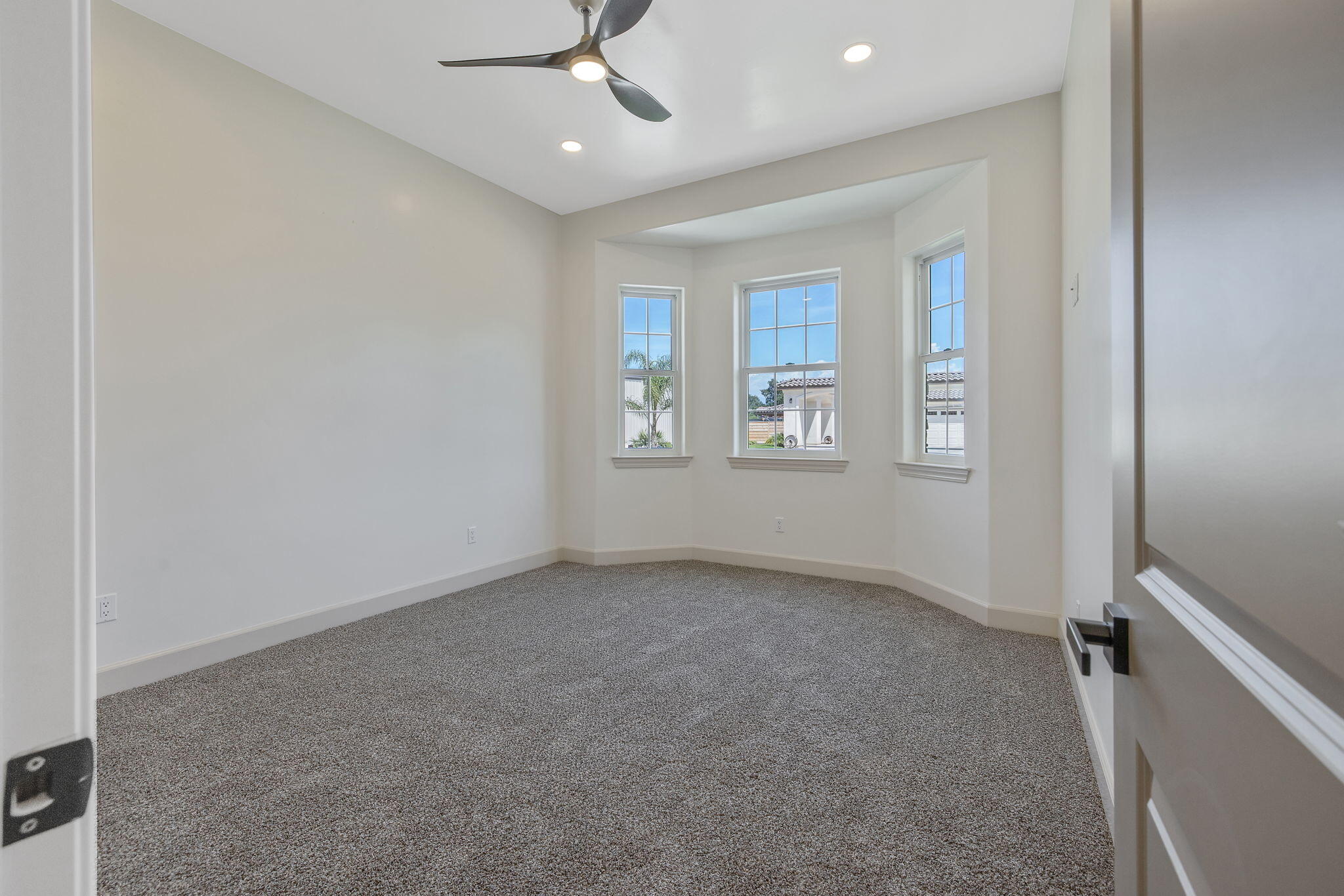 503 East Palm Street Exeter, CA 93221 - Photo 54 of 92 an empty room with windows and fan