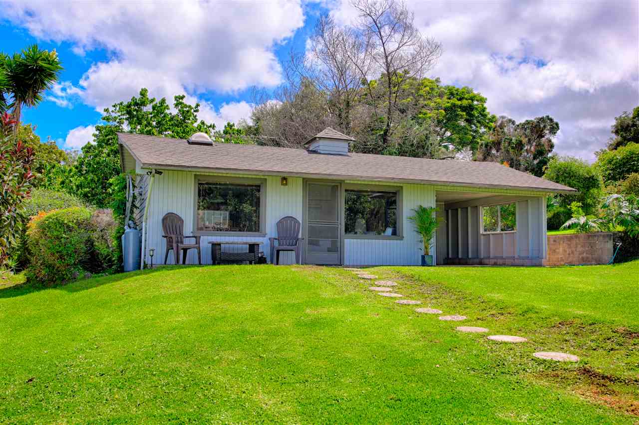 100 Ihe Place Kula, HI 96790 - Photo 14 of 18 a view of a house with a yard and potted plants