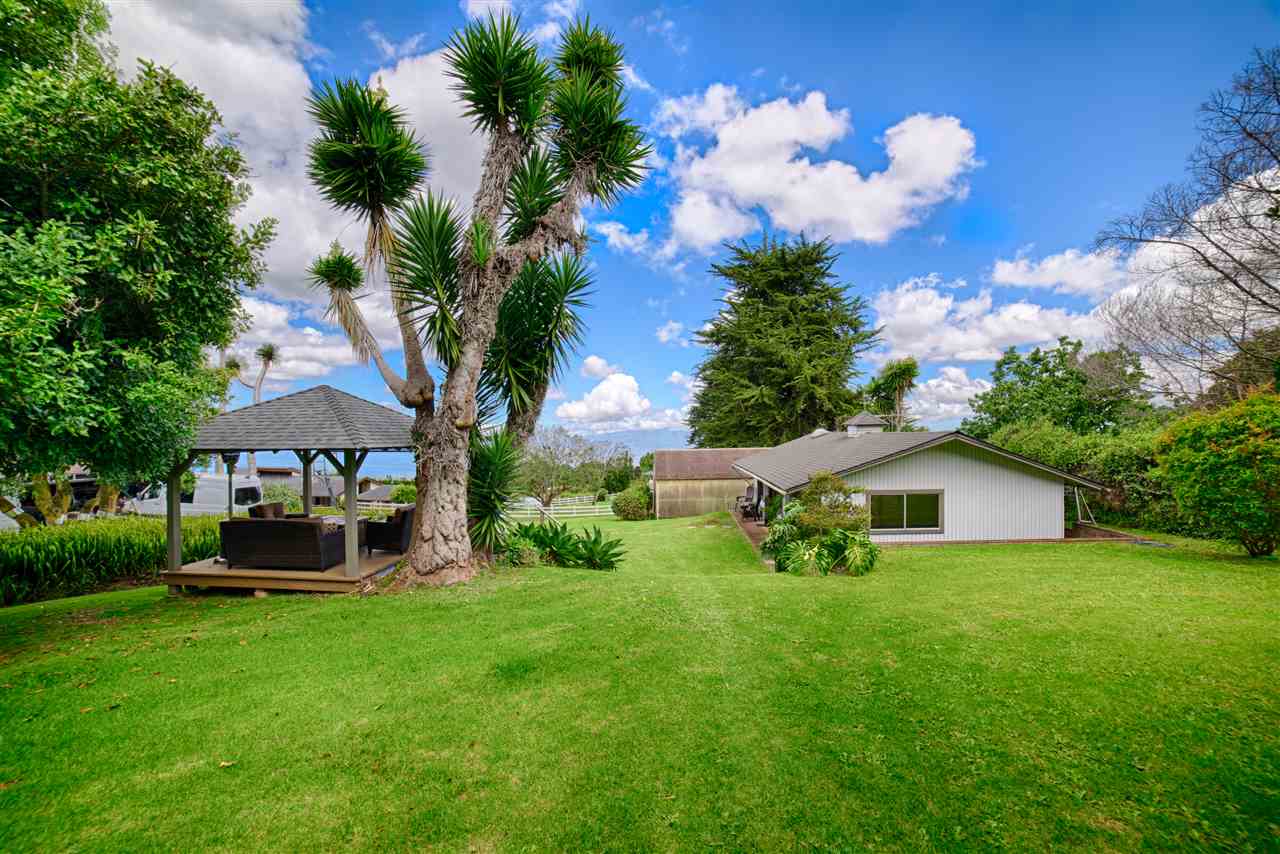100 Ihe Place Kula, HI 96790 - Photo 15 of 18 a front view of a house with garden