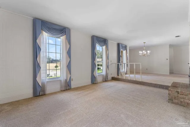 a view of a livingroom with a furniture and a ceiling fan