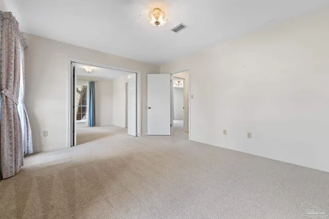 a view of balcony with wooden floor and fence
