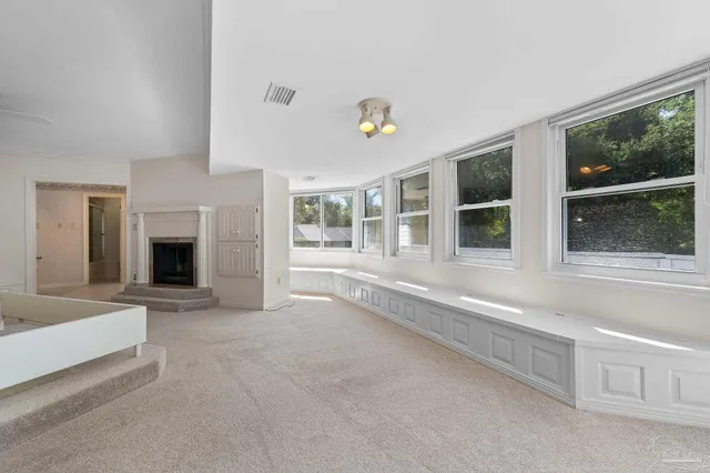 a view of empty room with wooden walls