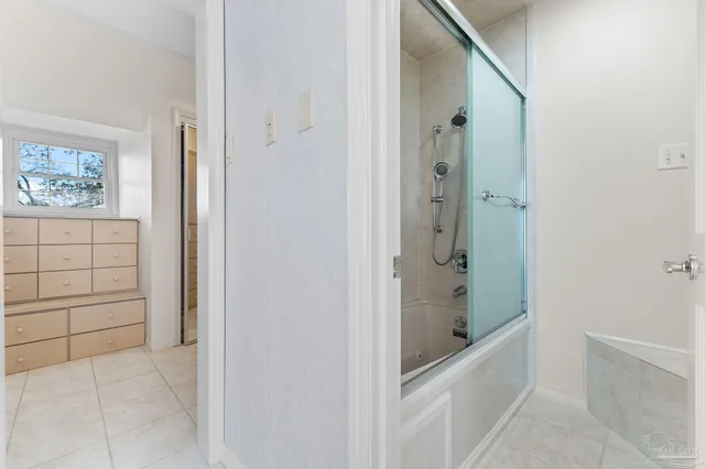 a view of a backyard with a small cabin and wooden fence