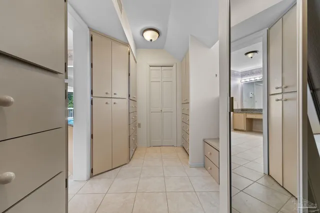 a view of a house with pool and chairs