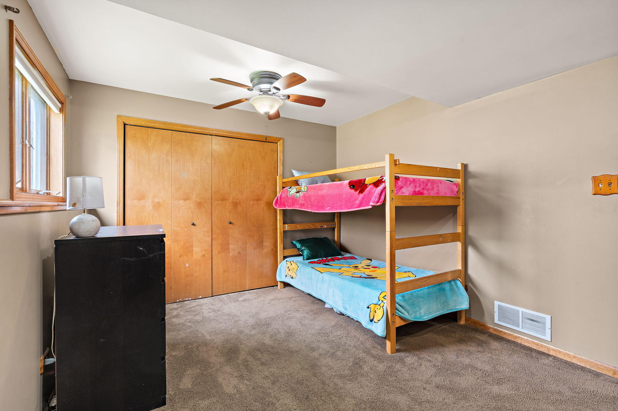 8987 Calhoun Place Crown Point, IN 46307 - Photo 20 of 28 a bedroom with a bed and a chandelier