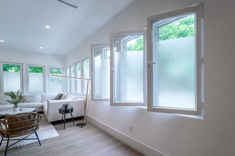 a bedroom with furniture and a window