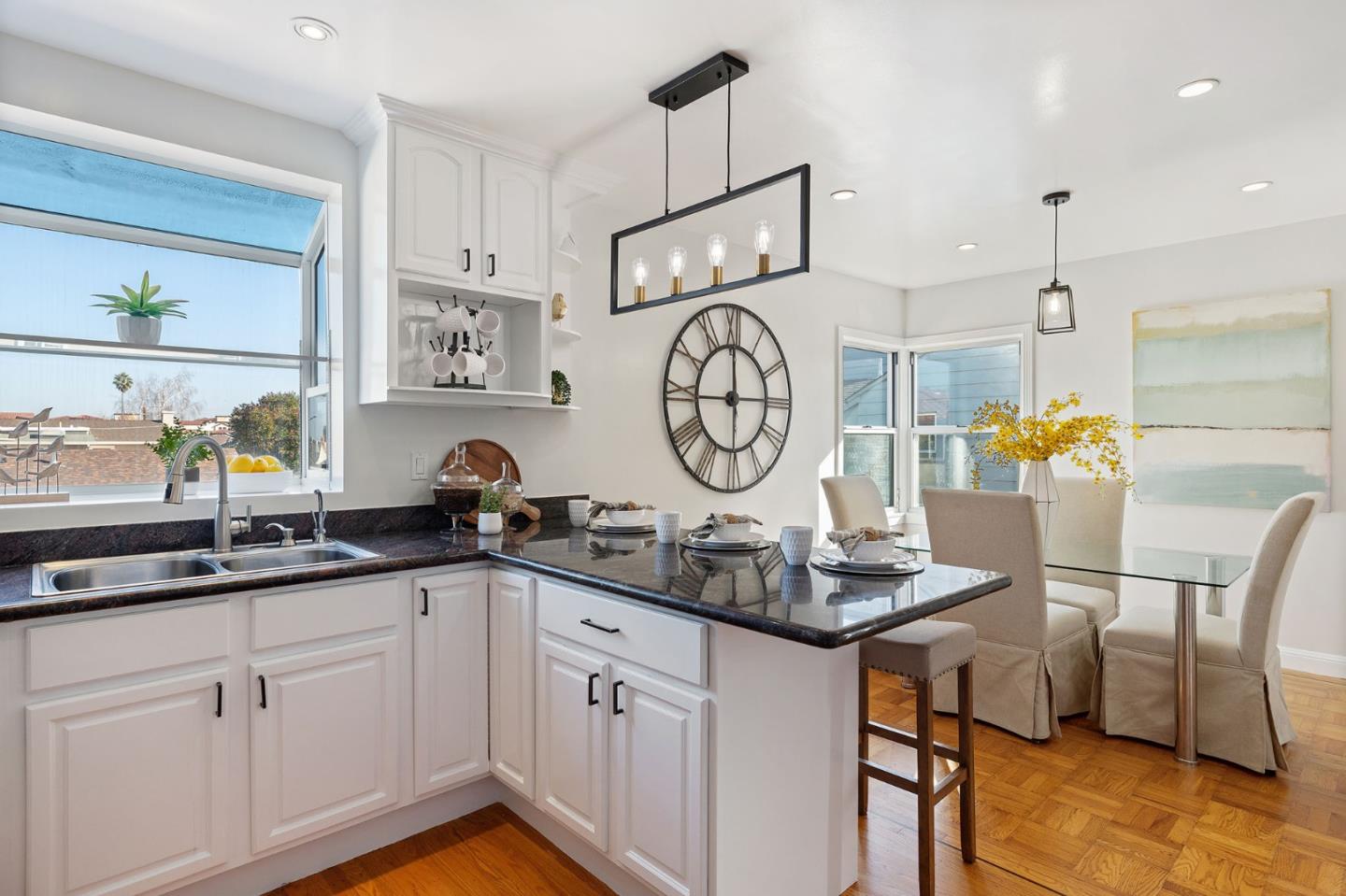 194 Willow Avenue Millbrae, CA 94030 - Photo 21 of 76 a kitchen with cabinets a sink and a stove with wooden floor