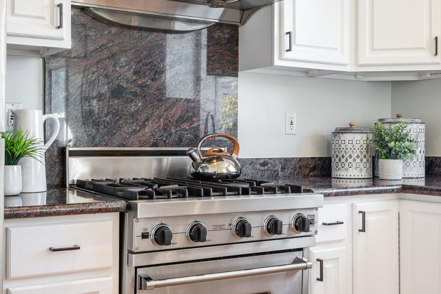 194 Willow Avenue Millbrae, CA 94030 - Photo 23 of 76 a close view of a stove top oven sitting inside of a kitchen