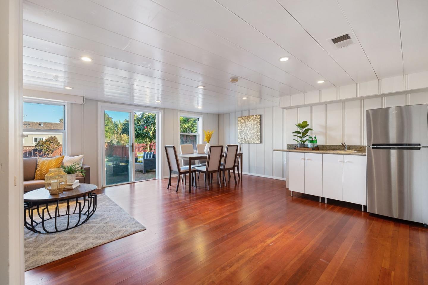 194 Willow Avenue Millbrae, CA 94030 - Photo 38 of 76 a kitchen with stainless steel appliances granite countertop wooden floors refrigerator and dining table