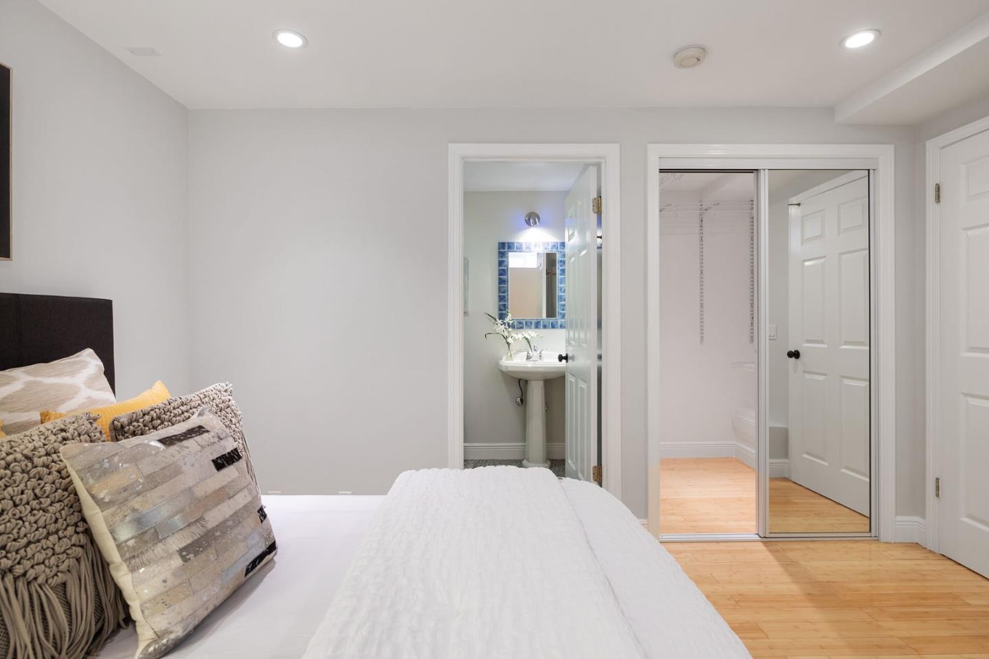 194 Willow Avenue Millbrae, CA 94030 - Photo 44 of 76 a bedroom with a bed and lamp