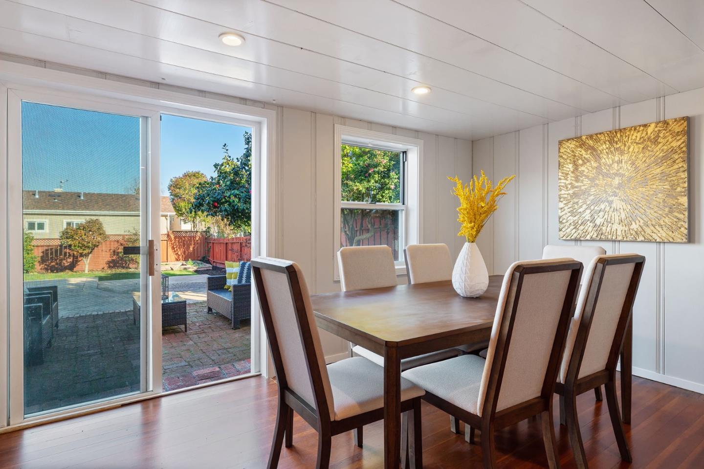 194 Willow Avenue Millbrae, CA 94030 - Photo 46 of 76 a view of a dining room with furniture and a potted plant