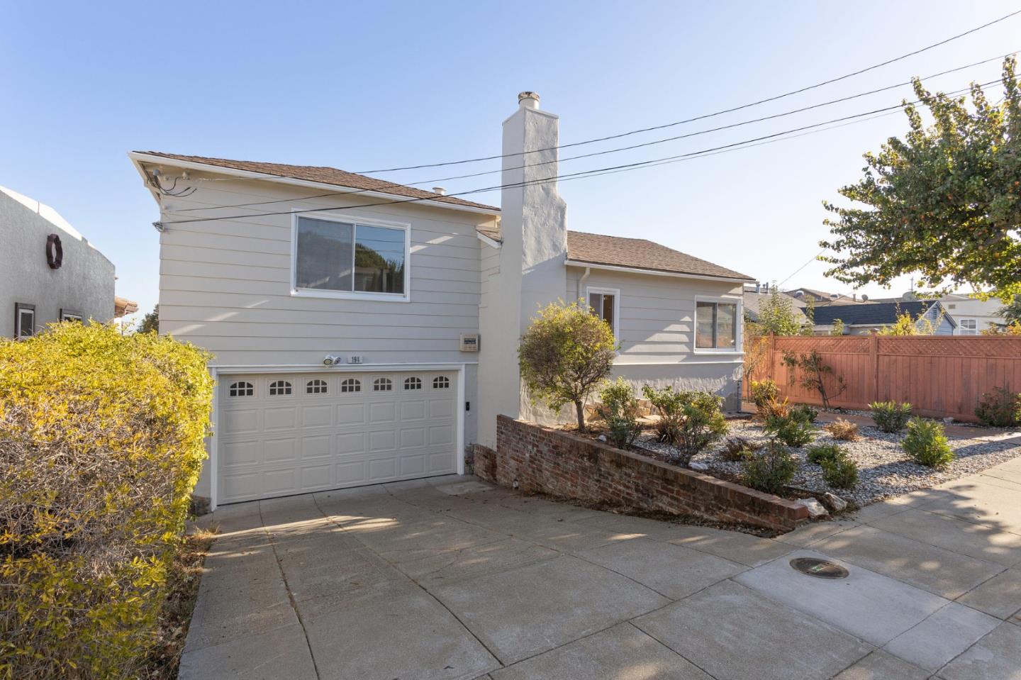 194 Willow Avenue Millbrae, CA 94030 - Photo 63 of 76 a view of a house with a backyard and garage