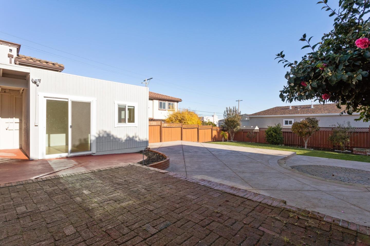 194 Willow Avenue Millbrae, CA 94030 - Photo 64 of 76 a view of a house with backyard and a garden