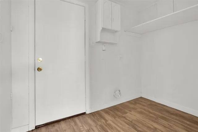 a view of a small space with wooden floor