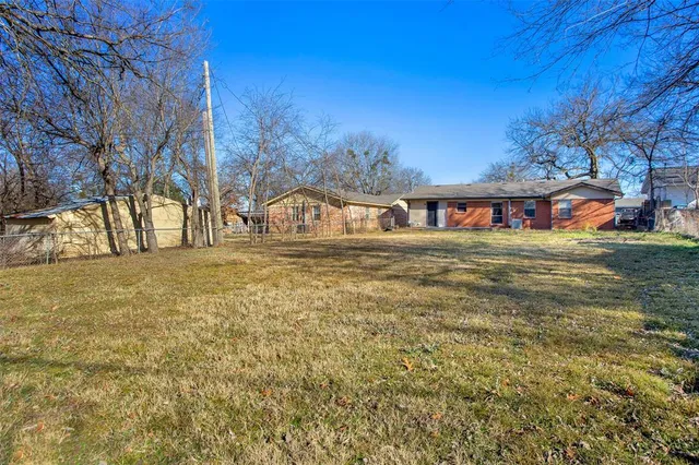a view of swimming pool with outdoor seating and covered with trees