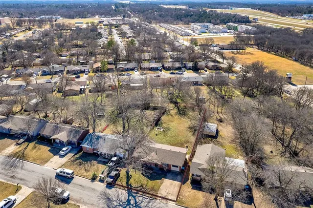 an aerial view of residential houses with outdoor space