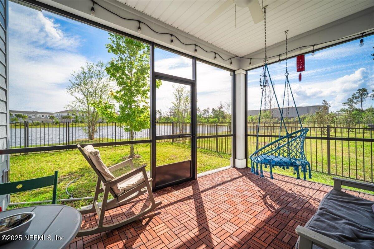 141 Killarney Avenue St. Johns, FL 32259 - Photo 33 of 33 a view of a balcony with lake view and wooden floor