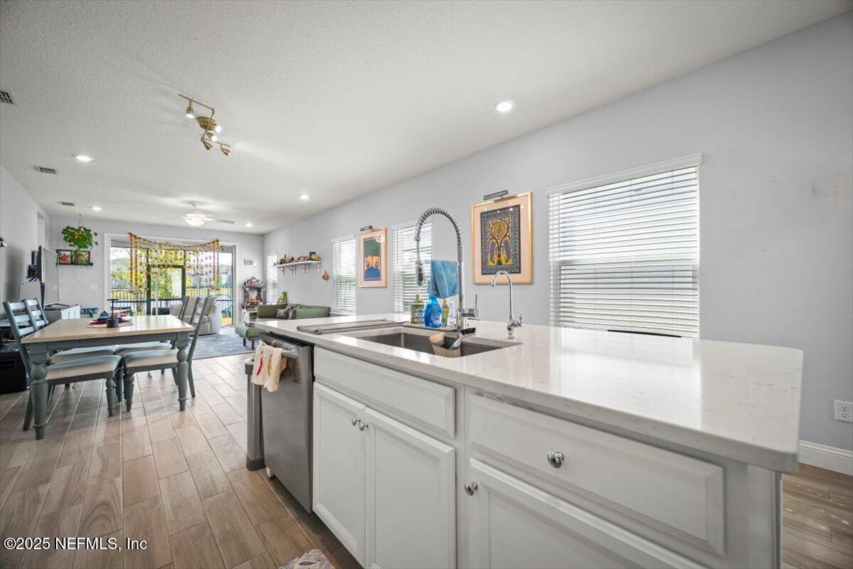 141 Killarney Avenue St. Johns, FL 32259 - Photo 4 of 33 a kitchen with lots of counter top space and living room