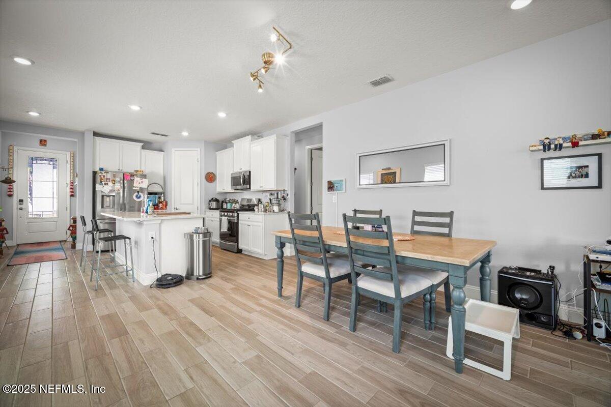 141 Killarney Avenue St. Johns, FL 32259 - Photo 7 of 33 a view of kitchen with cabinets and wooden floor