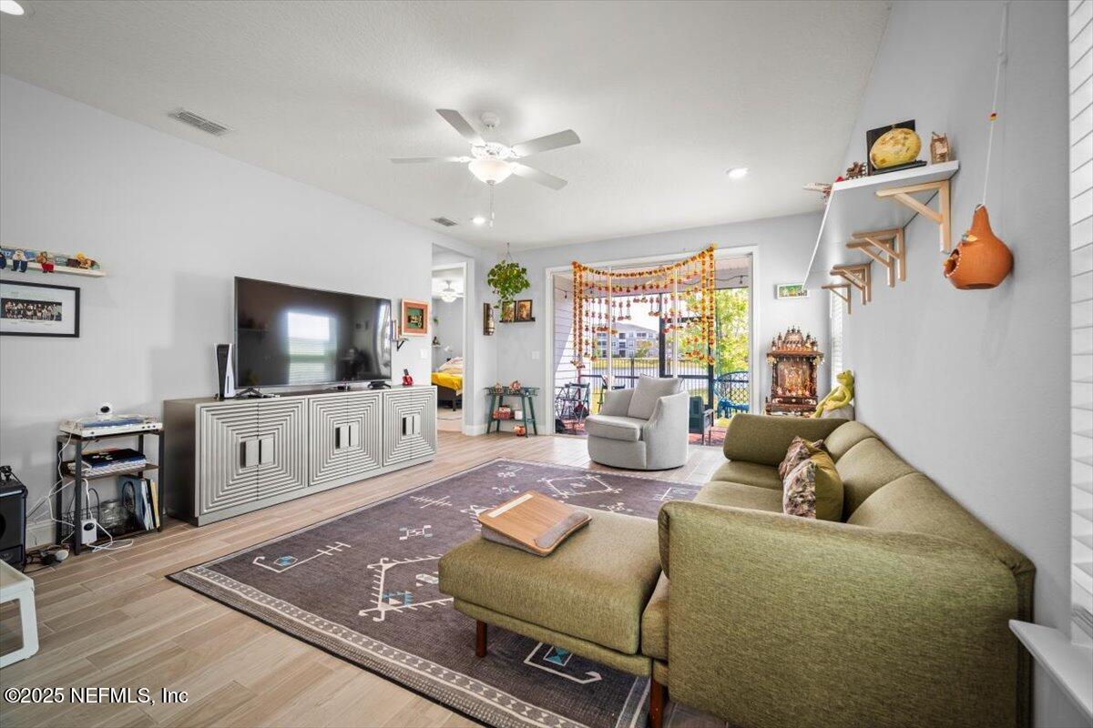 141 Killarney Avenue St. Johns, FL 32259 - Photo 8 of 33 a living room with furniture and a flat screen tv