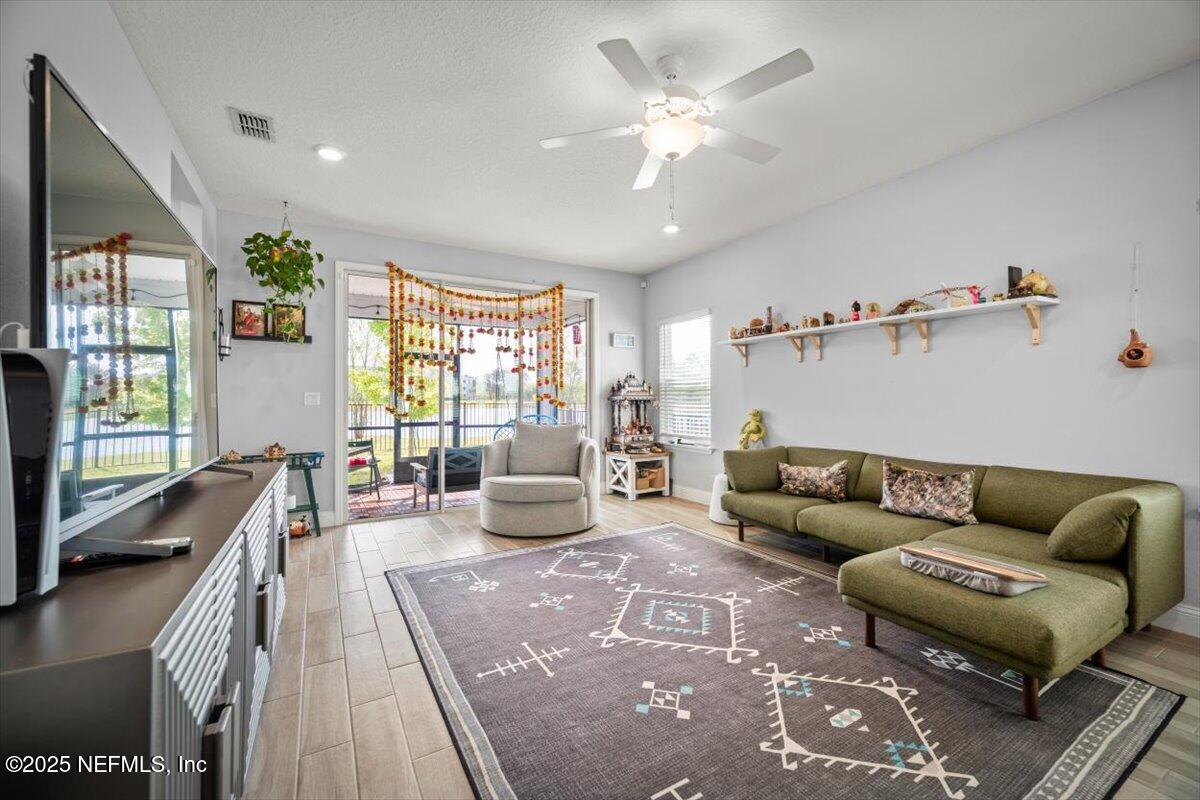 141 Killarney Avenue St. Johns, FL 32259 - Photo 9 of 33 a living room with furniture and a large window