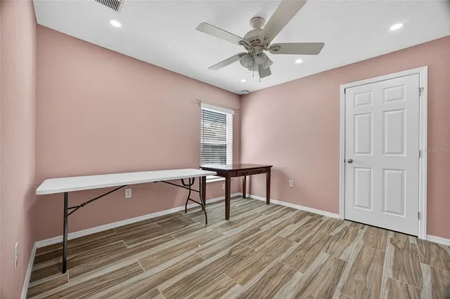 a view of room with a ceiling fan