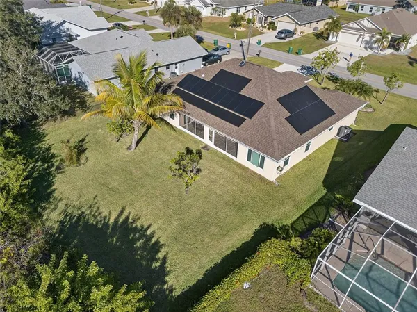 an aerial view of residential house with pool